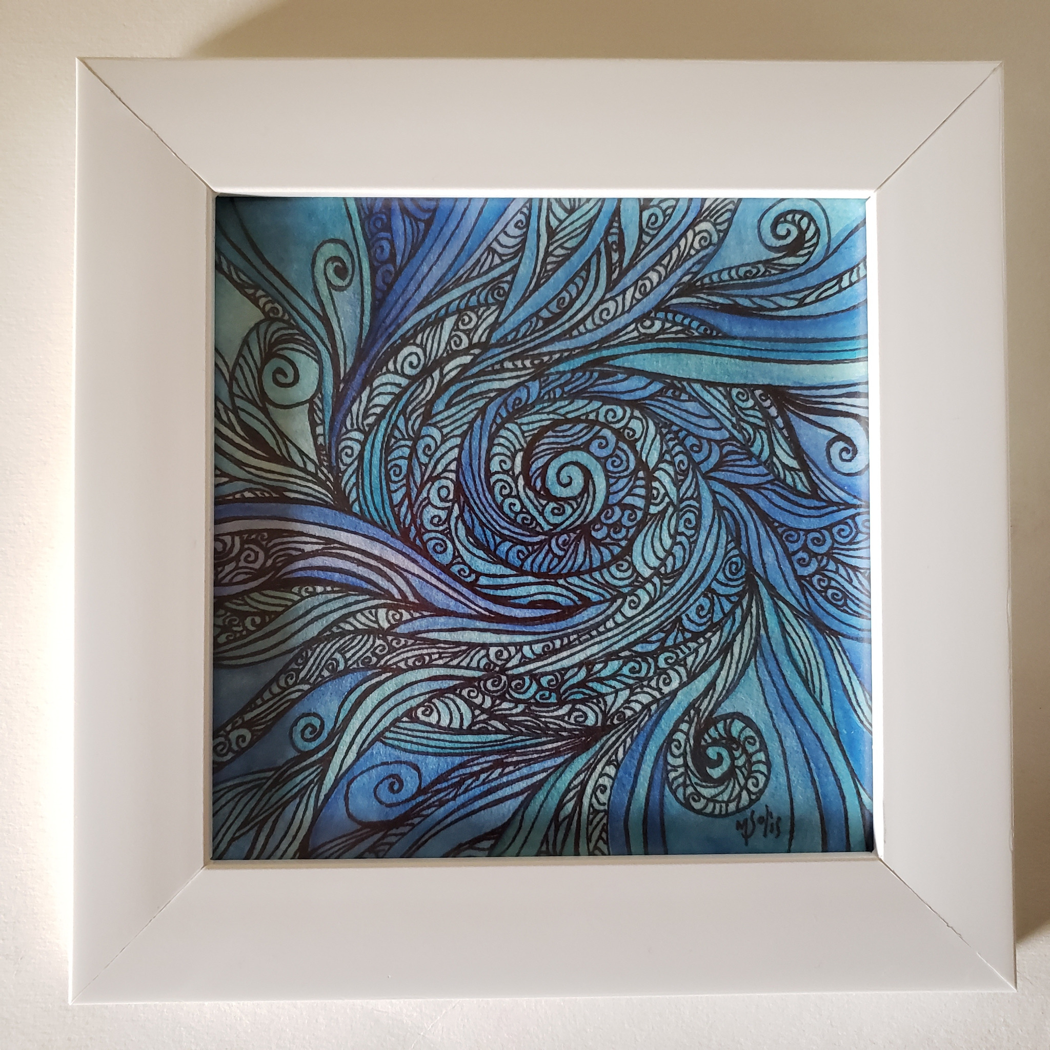 Obra original en espiral con tonos azul y turquesa, enmarcada en blanco