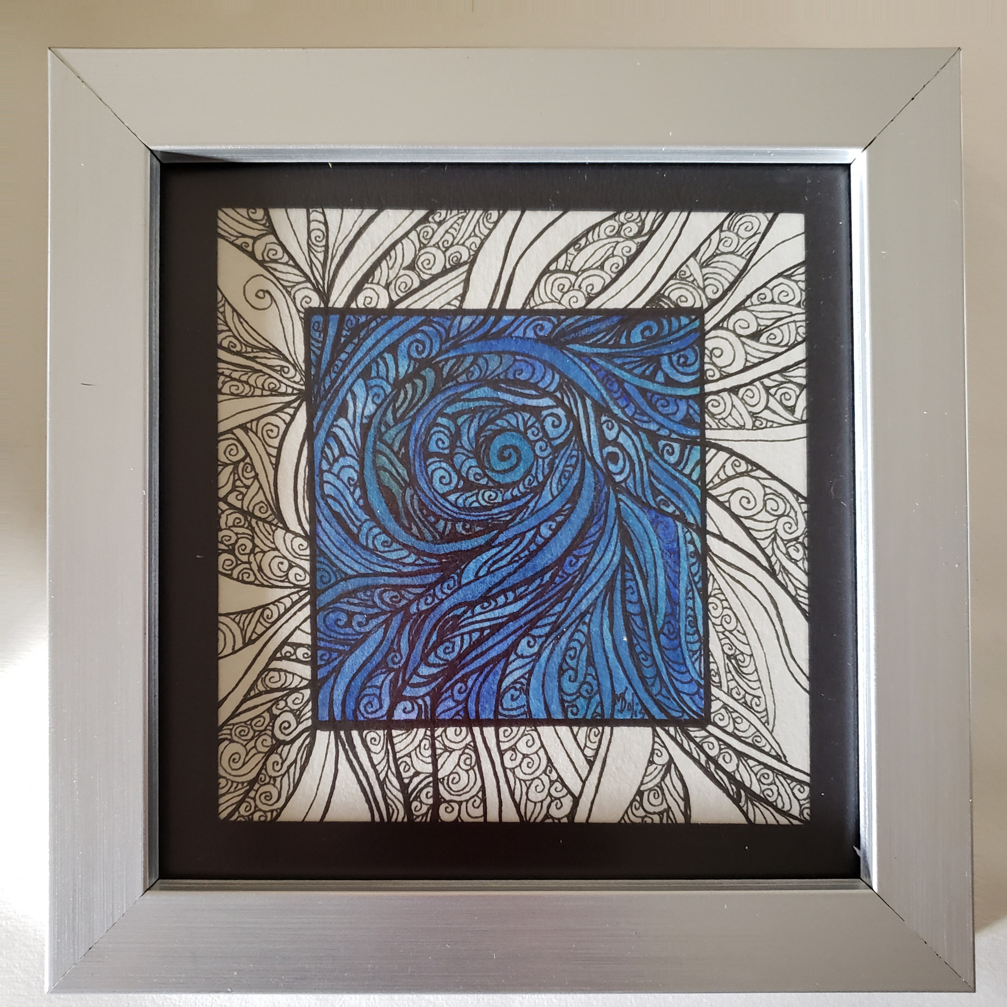 Obra original en espiral azul con marco plata y marialuisa negra